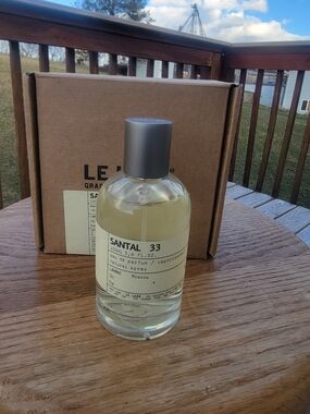Le Labo Santal 33 Bottle with Silver Cap and Clear Liquid  New in box and sealed